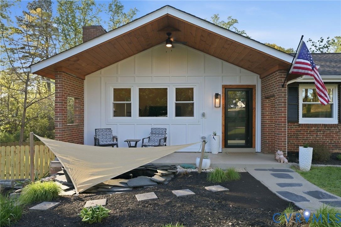 1100 Hollins Road Henrico, VA 23229 - Photo 2 of 38 a backyard of a house with seating space