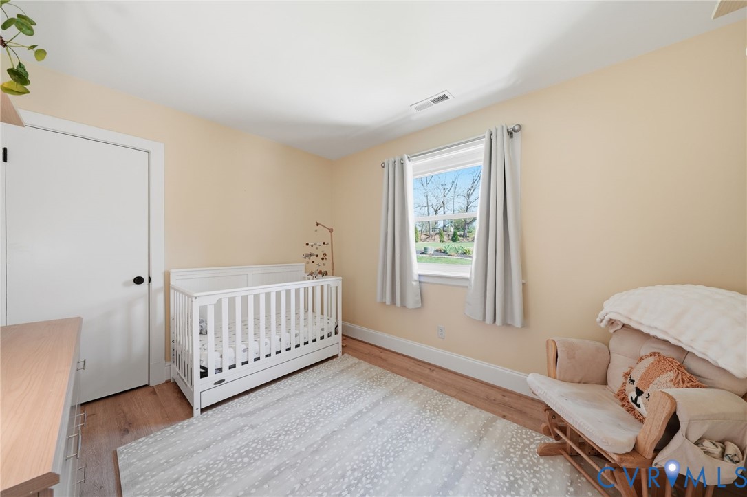 1100 Hollins Road Henrico, VA 23229 - Photo 23 of 38 a bedroom with a bed and window