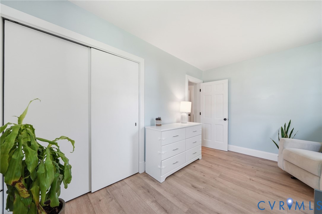 1100 Hollins Road Henrico, VA 23229 - Photo 24 of 38 a room with white cabinets and a wooden floor