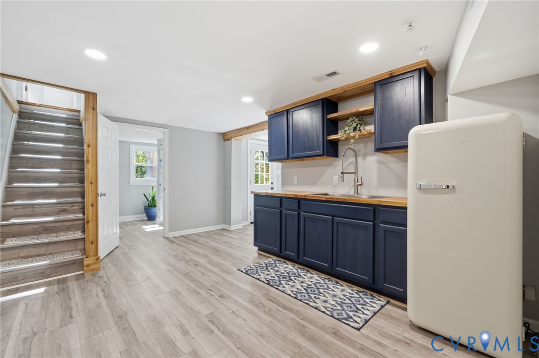 1100 Hollins Road Henrico, VA 23229 - Photo 28 of 38 a kitchen with stainless steel appliances granite countertop a refrigerator sink and cabinets