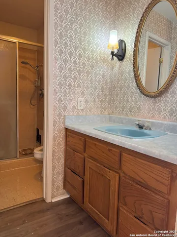 a bathroom with a sink and a mirror