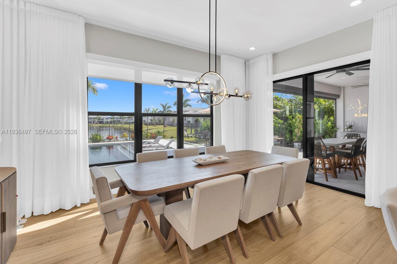 20310 Whistling Straits Way Boca Raton, FL 33434 - Photo 16 of 73 a view of a dining room with furniture window and wooden floor