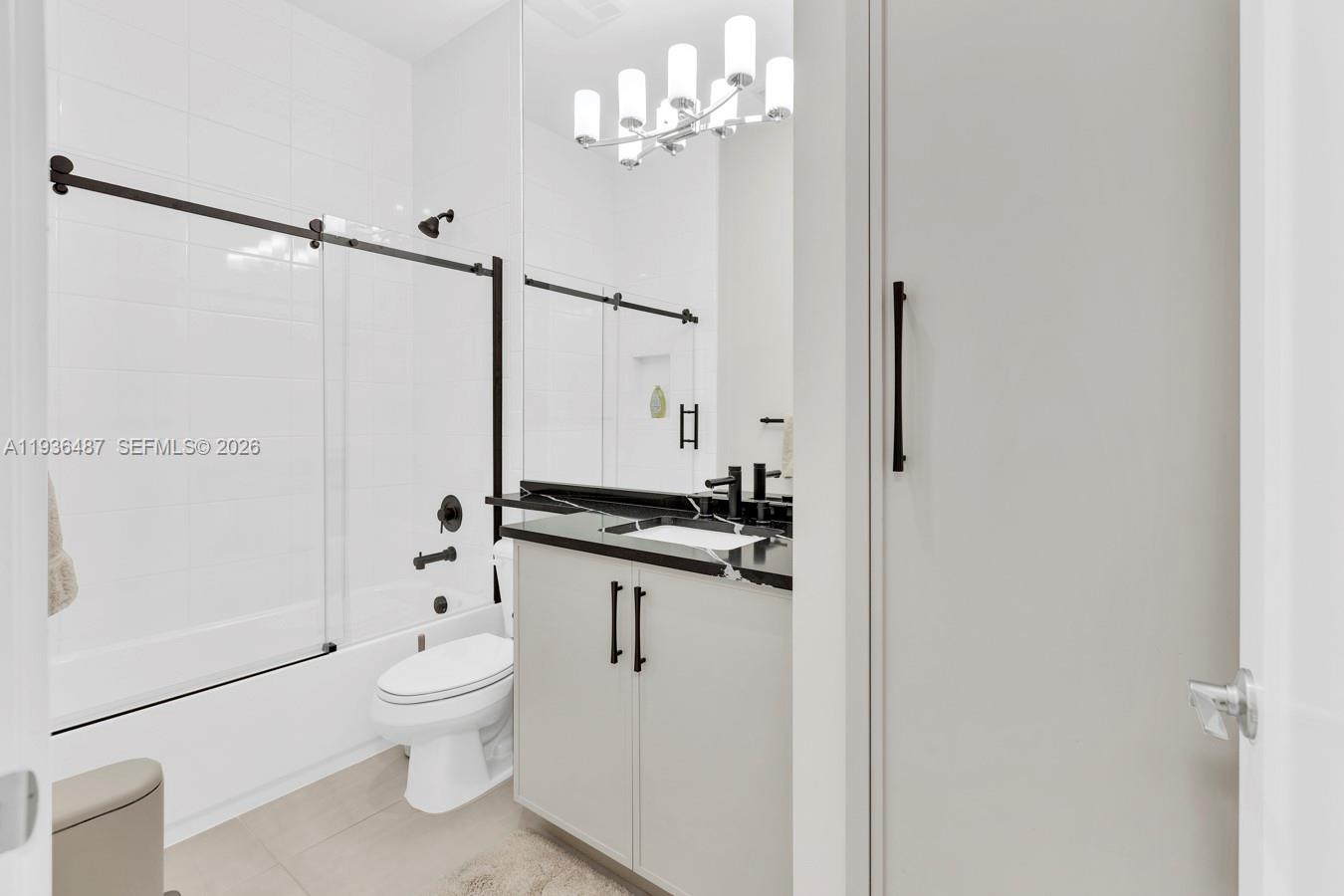 20310 Whistling Straits Way Boca Raton, FL 33434 - Photo 20 of 73 a bathroom with a toilet a sink and a shower