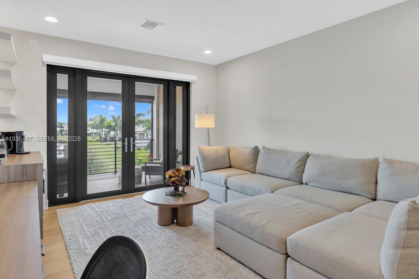 20310 Whistling Straits Way Boca Raton, FL 33434 - Photo 25 of 73 a living room with furniture and floor to ceiling window