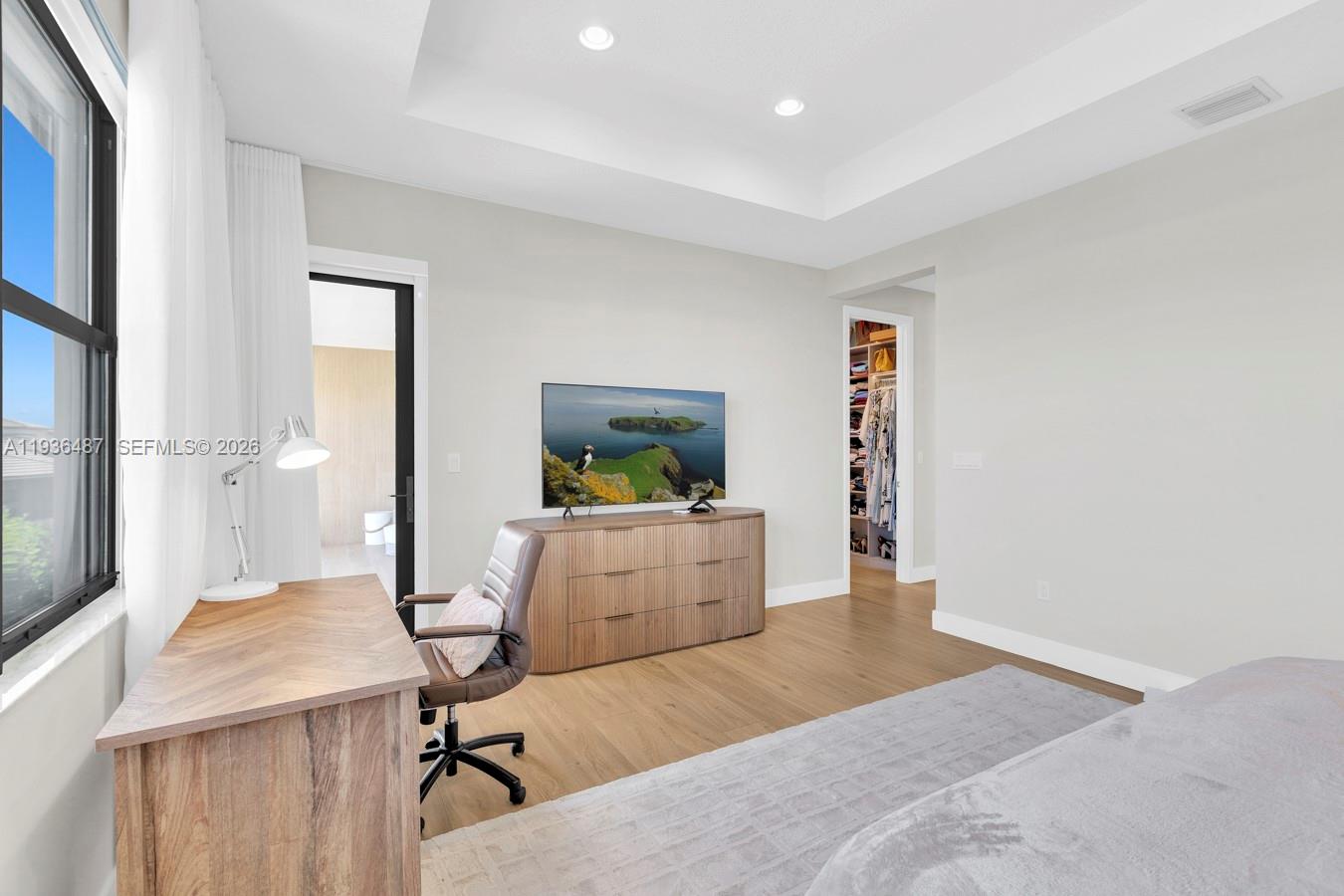 20310 Whistling Straits Way Boca Raton, FL 33434 - Photo 33 of 73 a bedroom with a bed and a dresser in it