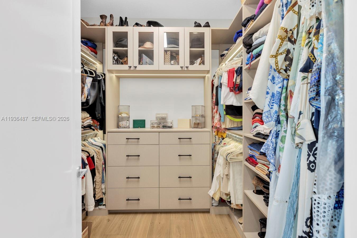 20310 Whistling Straits Way Boca Raton, FL 33434 - Photo 35 of 73 a view of walk in closet with clothes and shoes
