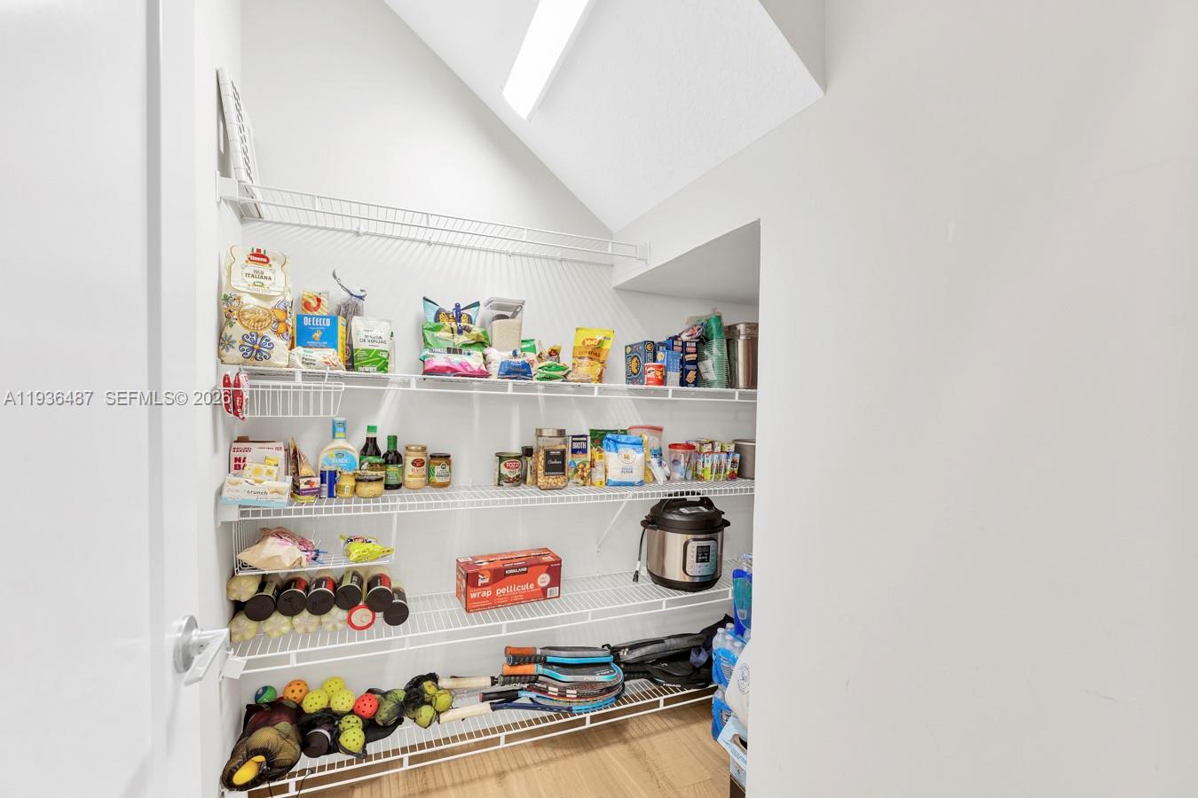 20310 Whistling Straits Way Boca Raton, FL 33434 - Photo 38 of 73 a room with lots of clutter and refrigerator