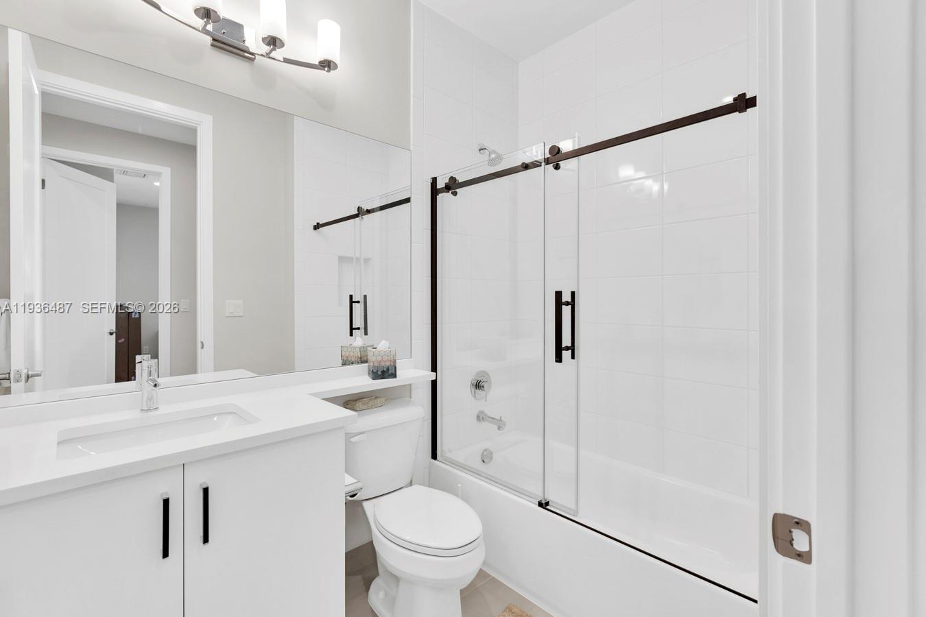 20310 Whistling Straits Way Boca Raton, FL 33434 - Photo 43 of 73 a bathroom with a sink toilet and shower