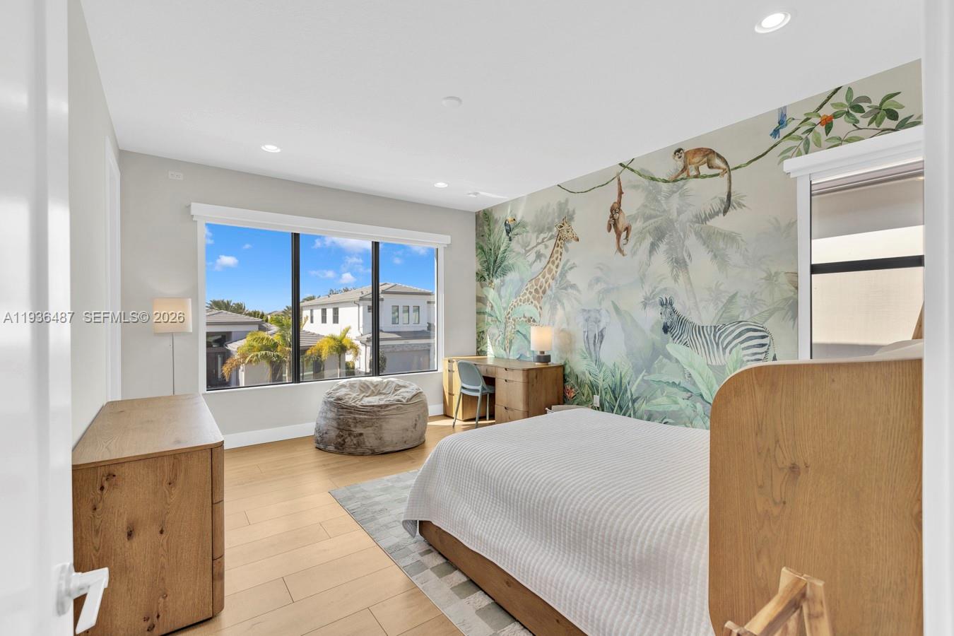 20310 Whistling Straits Way Boca Raton, FL 33434 - Photo 48 of 73 a bedroom with a large bed and windows