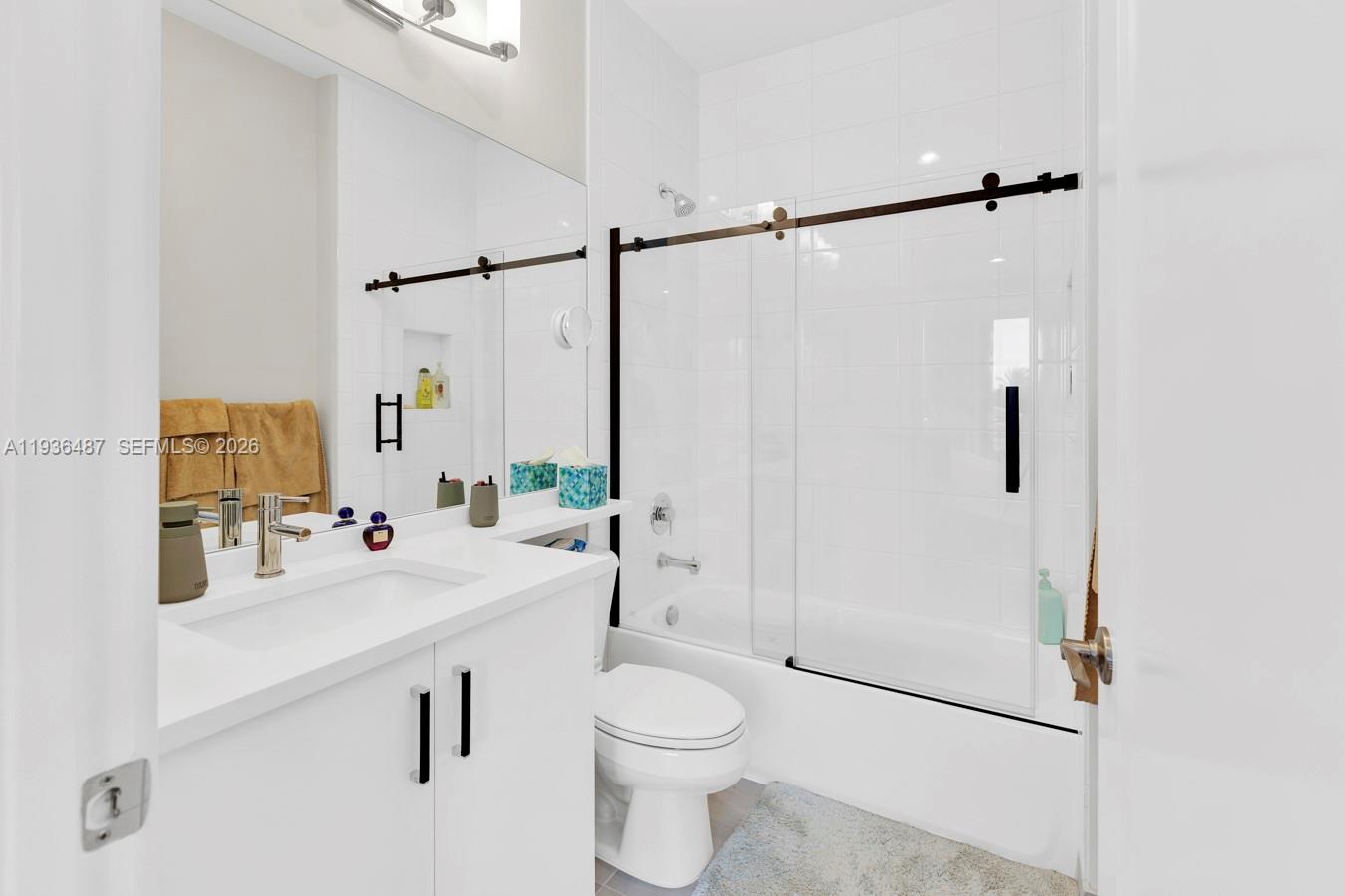 20310 Whistling Straits Way Boca Raton, FL 33434 - Photo 49 of 73 a bathroom with a sink a toilet and shower