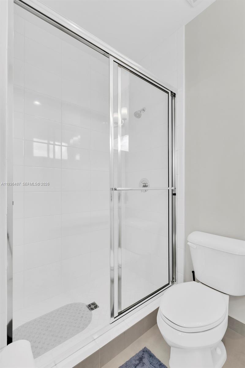 20310 Whistling Straits Way Boca Raton, FL 33434 - Photo 54 of 73 a white toilet sitting next to a bathroom