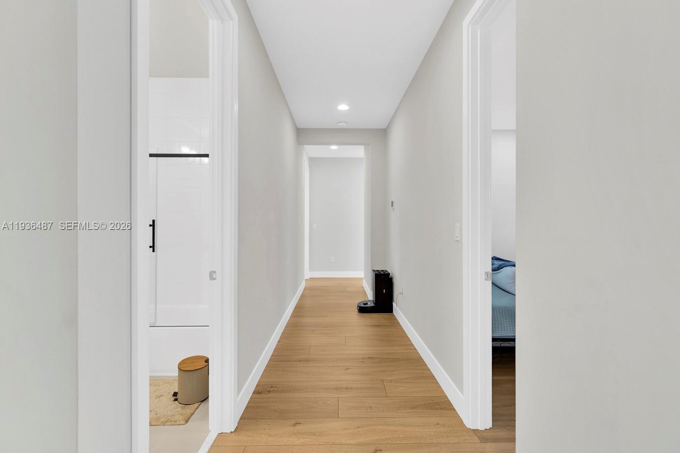 20310 Whistling Straits Way Boca Raton, FL 33434 - Photo 56 of 73 a view of a hallway with wooden floor and staircase