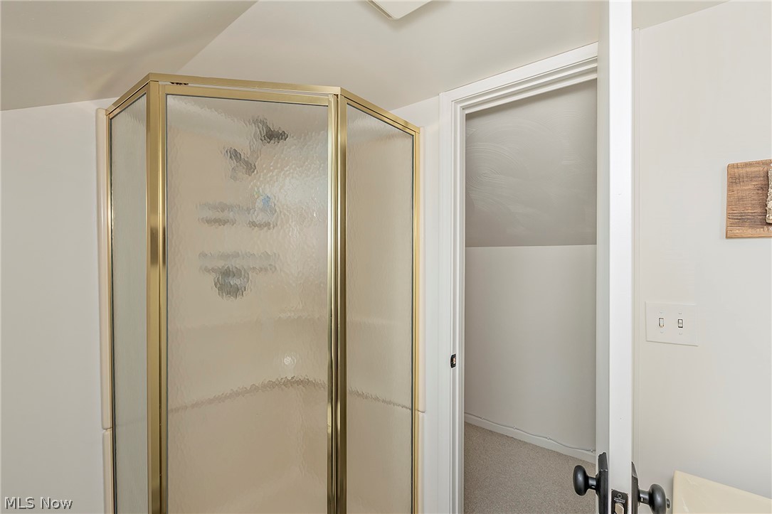 11292 Butternut Road Chardon, OH 44024 - Photo 34 of 49 Corner shower enclosure with gold-tone framing and textured glass panels