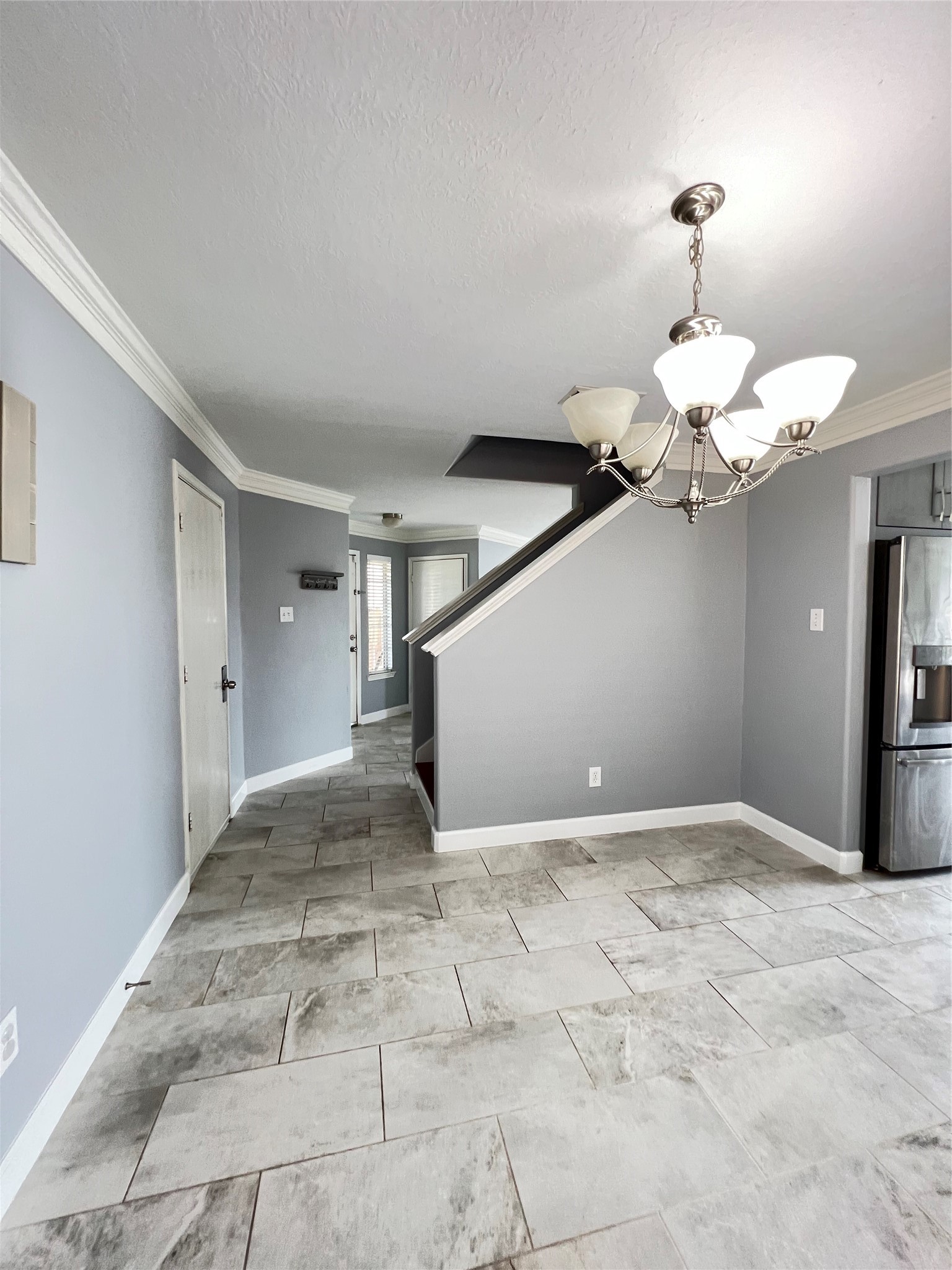 20035 Oland Way Houston, TX 77073 - Photo 8 of 11 a view of a livingroom with a chandelier