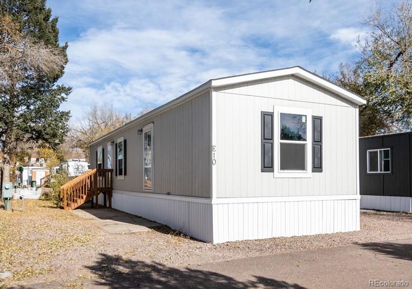 3100 Wood Avenue Colorado Springs, CO 80907 - Photo 1 of 32 a view of a house with a snow in the yard