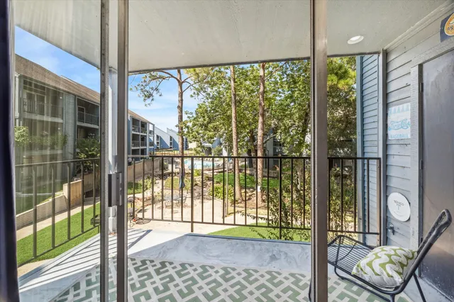 a view of a porch with a floor to ceiling window