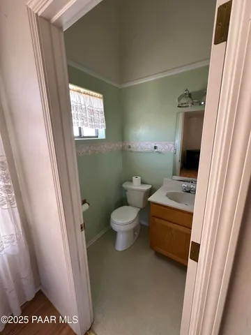 a view of a livingroom with furniture and a lamp