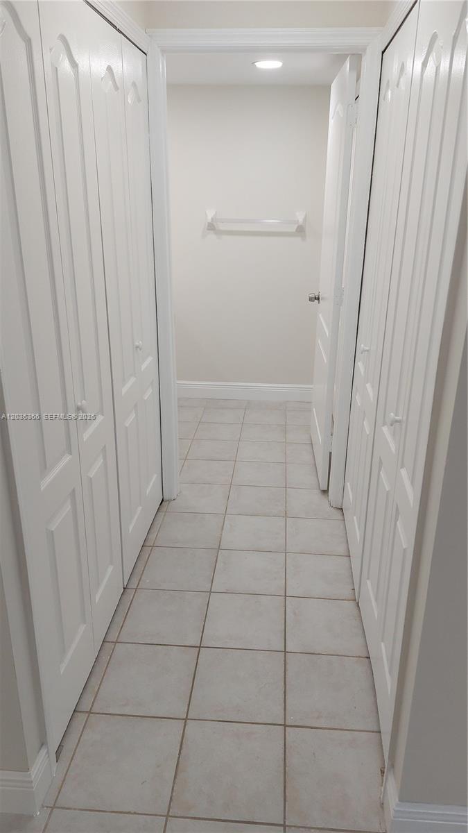 7083 Southwest 158th Court Miami, FL 33193 - Photo 4 of 22 a view of a utility room with door