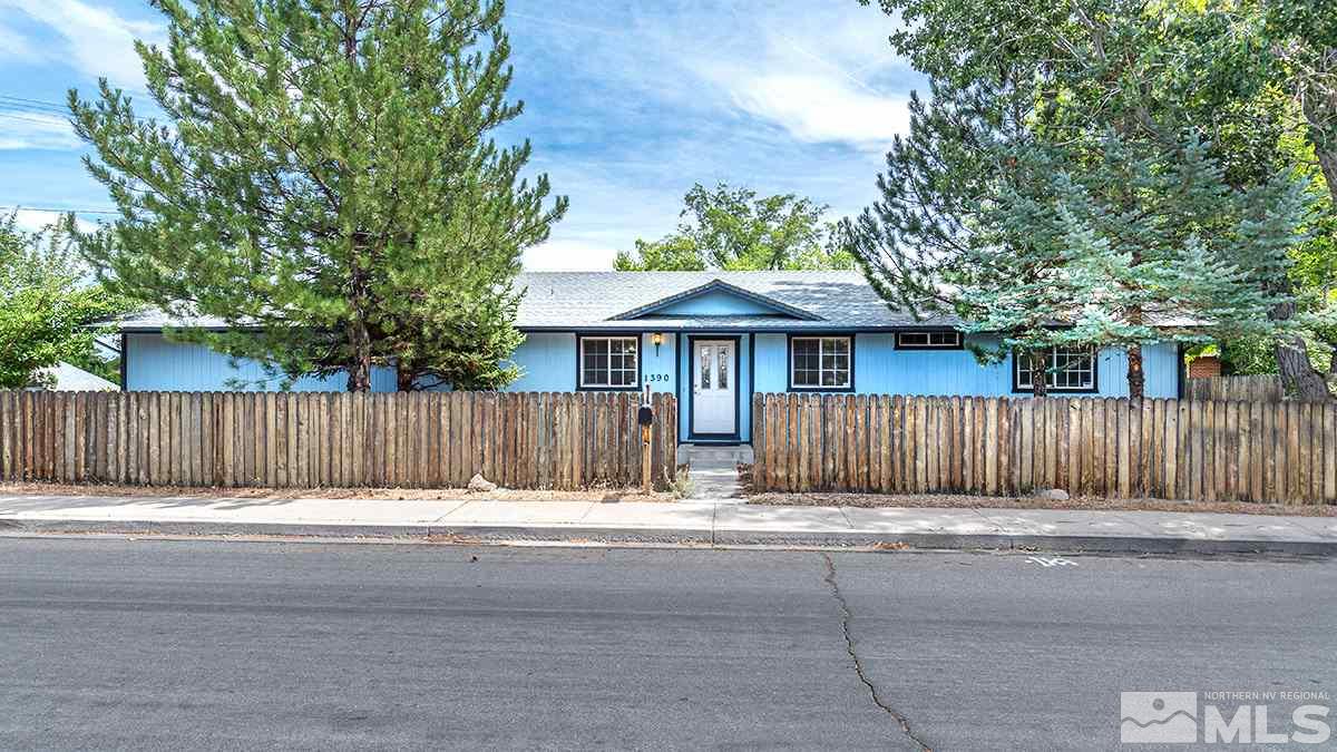 1390 Washington Street Reno, NV 89503 - Photo 1 of 16 a view of house with a small yard and wooden fence