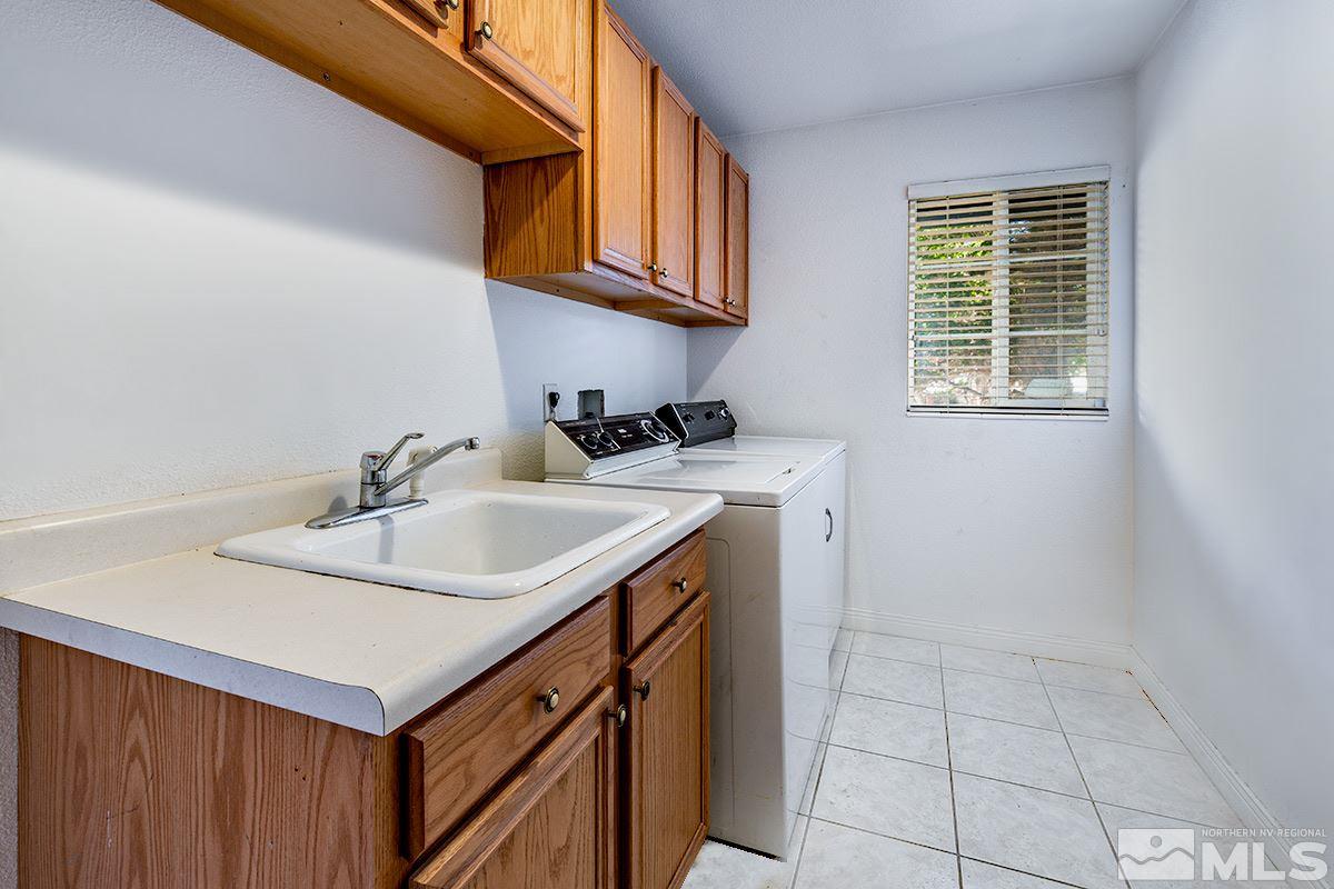 1390 Washington Street Reno, NV 89503 - Photo 12 of 16 a bathroom with a sink a vanity and a mirror
