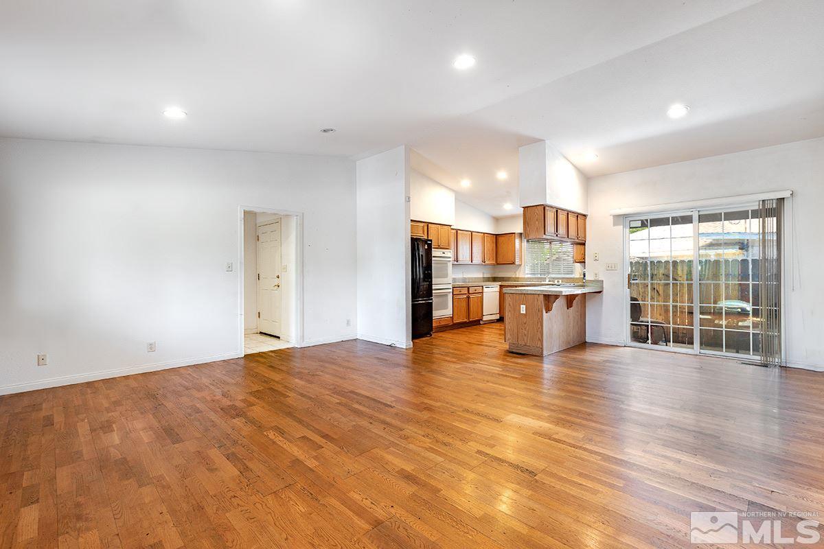 1390 Washington Street Reno, NV 89503 - Photo 4 of 16 a view of empty room with wooden floor and windows