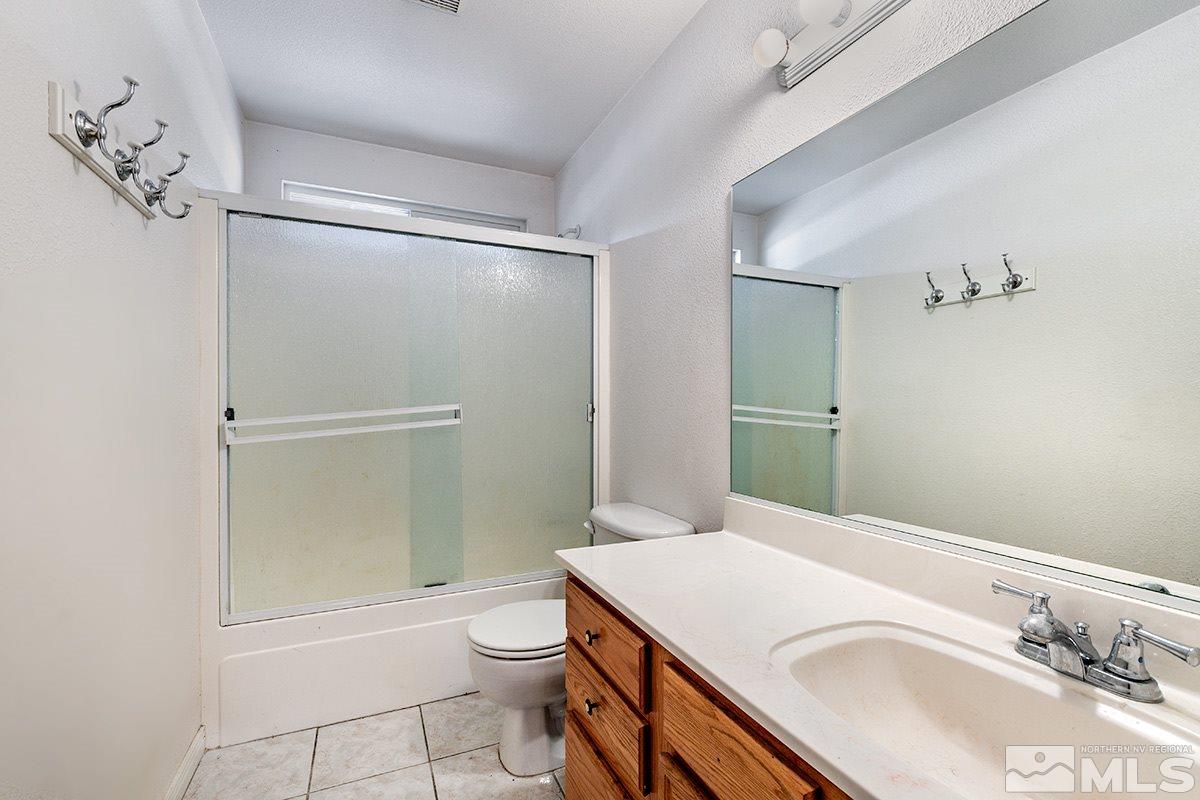 1390 Washington Street Reno, NV 89503 - Photo 6 of 16 a bathroom with a sink toilet and shower