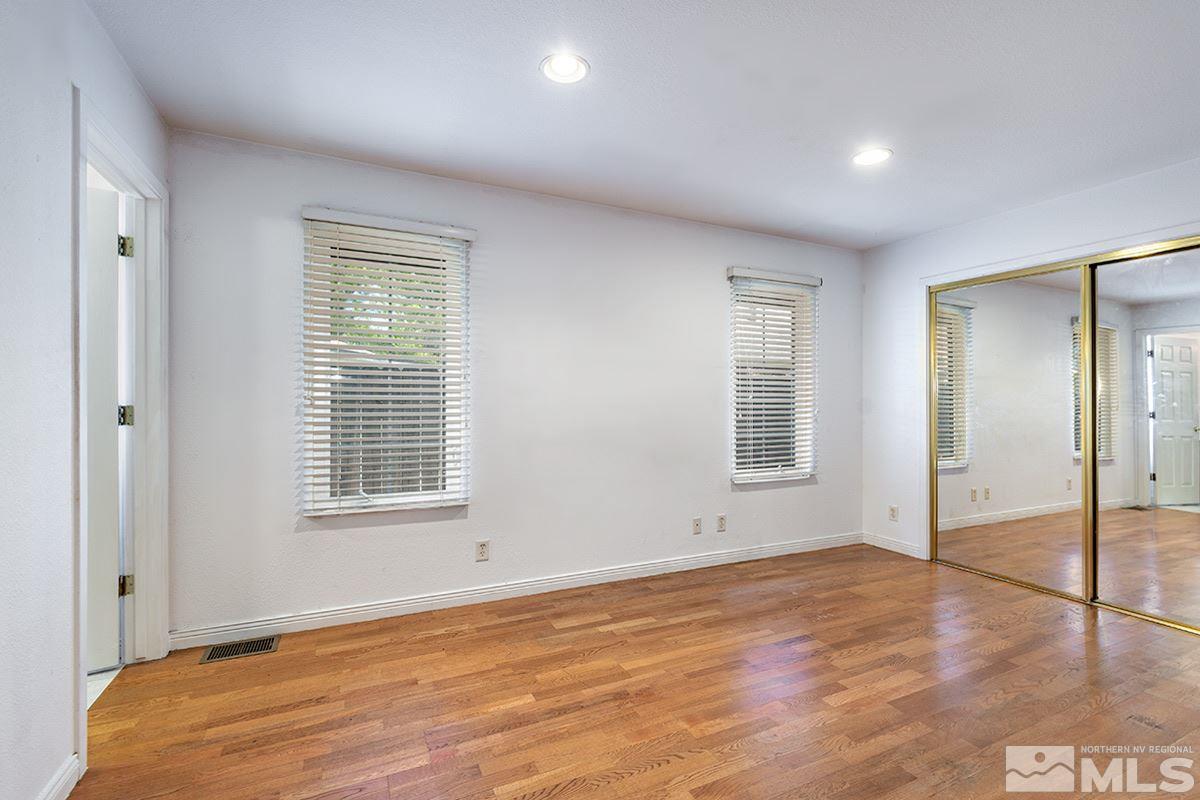 1390 Washington Street Reno, NV 89503 - Photo 7 of 16 an empty room with wooden floor and windows