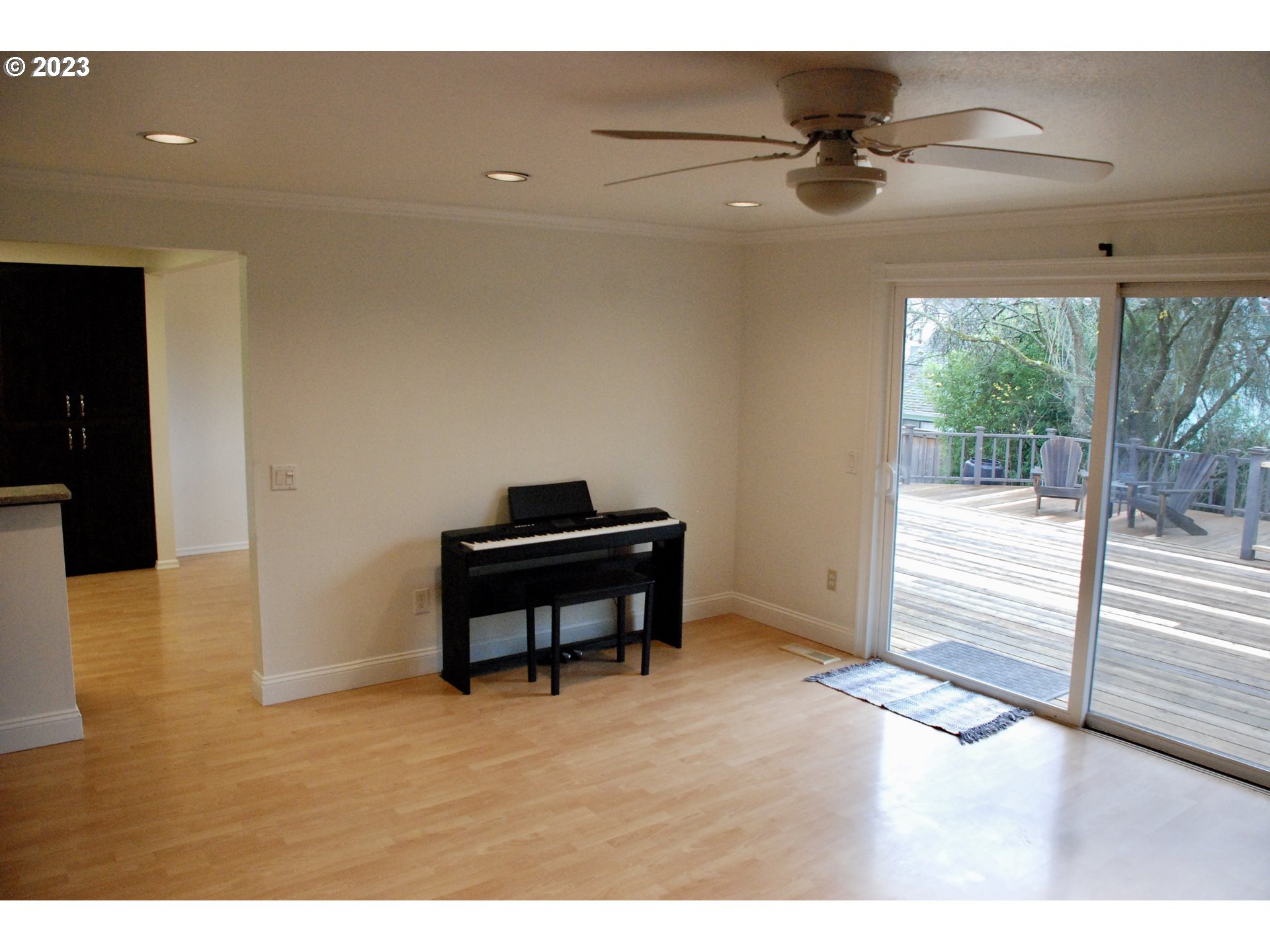 7175 Southwest 173rd Avenue Beaverton, OR 97007 - Photo 12 of 20 a view of a room with a ceiling fan and wooden floor