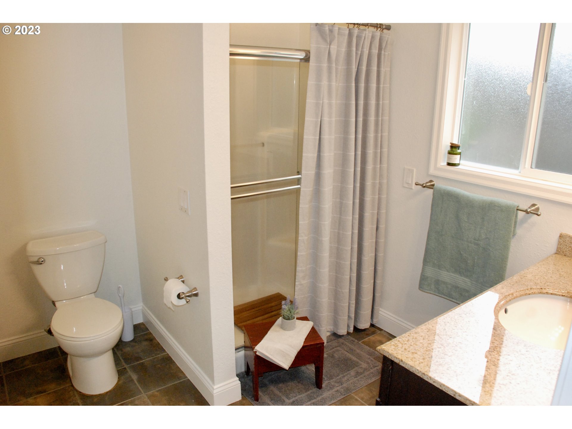7175 Southwest 173rd Avenue Beaverton, OR 97007 - Photo 15 of 20 a bathroom with a toilet and a mirror