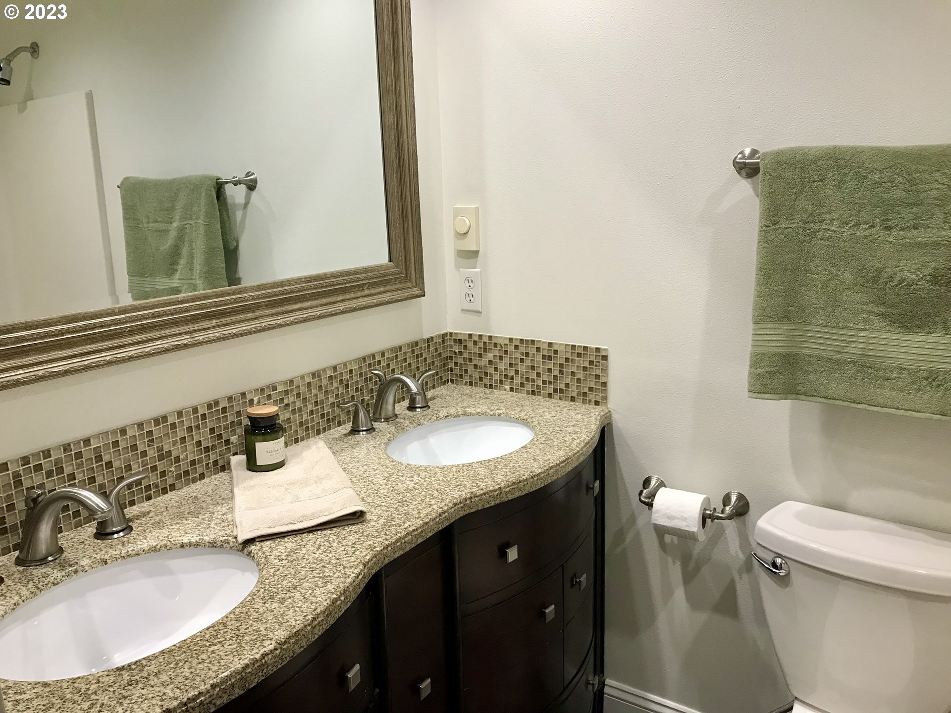 7175 Southwest 173rd Avenue Beaverton, OR 97007 - Photo 18 of 20 a bathroom with a granite countertop sink and a mirror