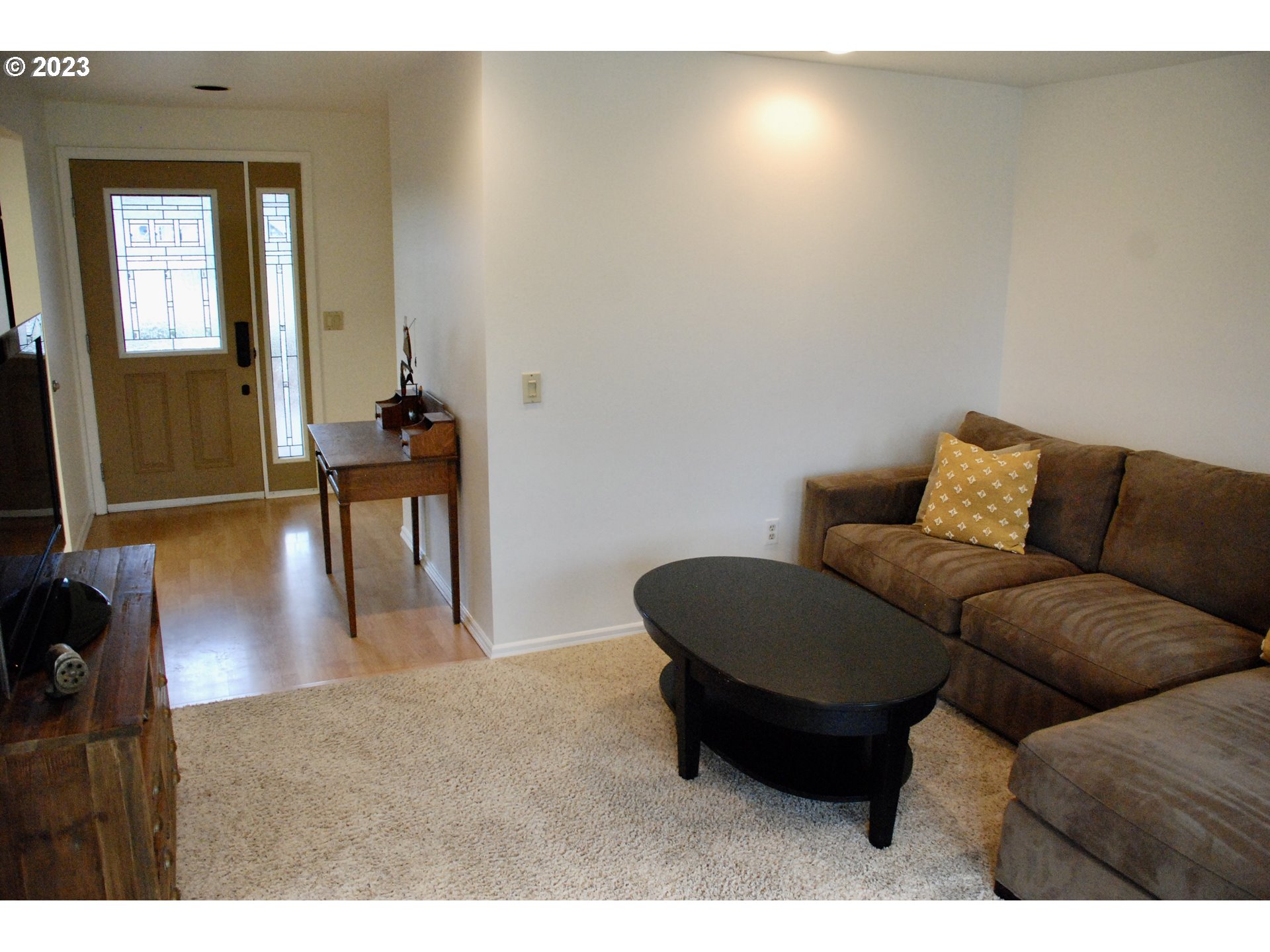 7175 Southwest 173rd Avenue Beaverton, OR 97007 - Photo 3 of 20 a living room with furniture and a flat screen tv
