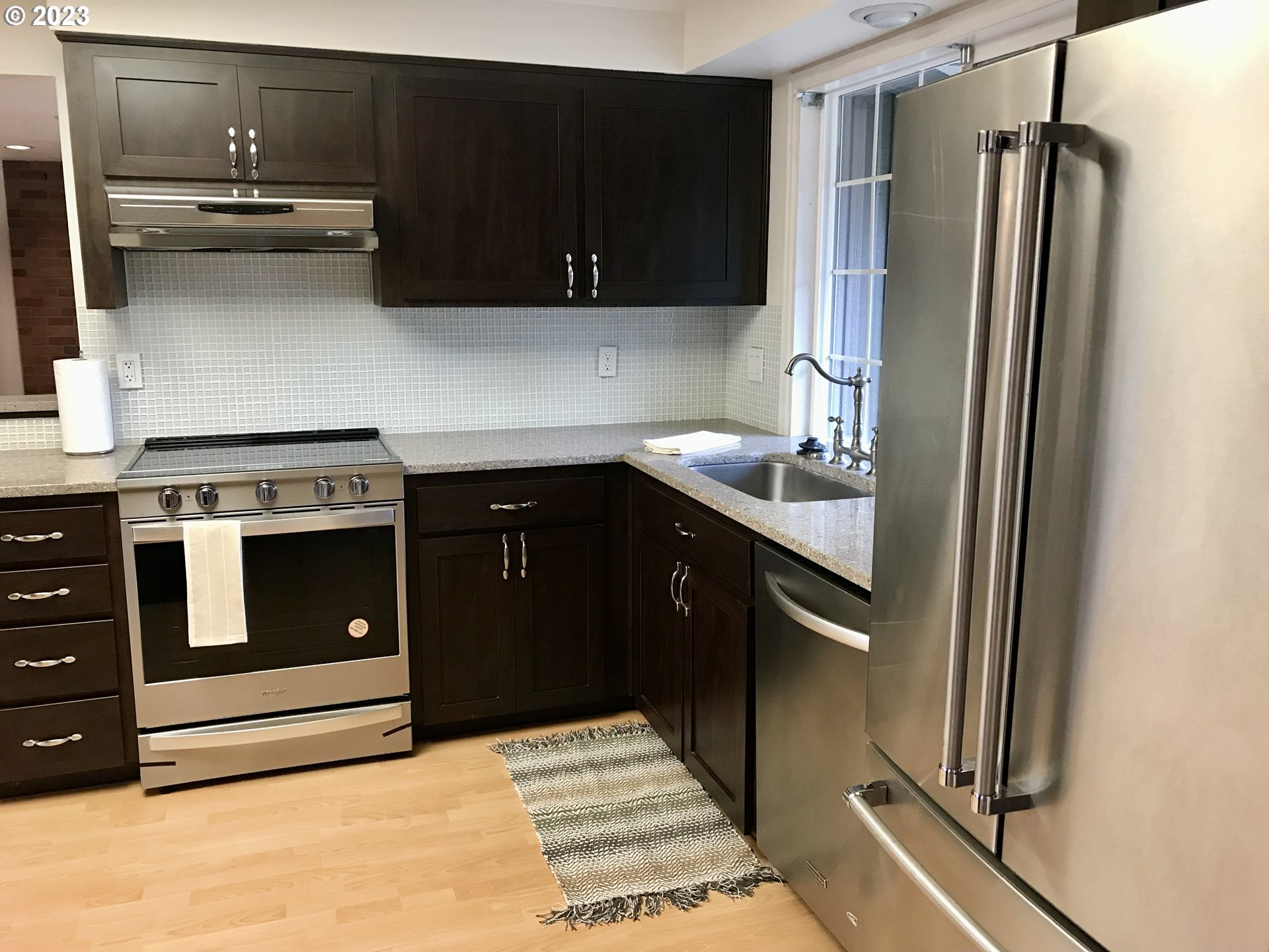 7175 Southwest 173rd Avenue Beaverton, OR 97007 - Photo 6 of 20 a kitchen with a stove and a refrigerator