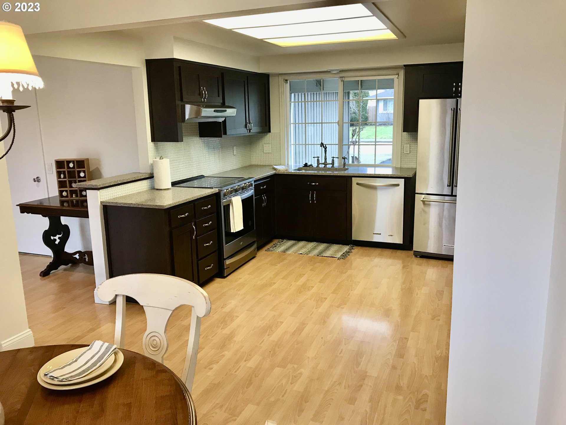 7175 Southwest 173rd Avenue Beaverton, OR 97007 - Photo 7 of 20 a kitchen with a sink appliances and cabinets