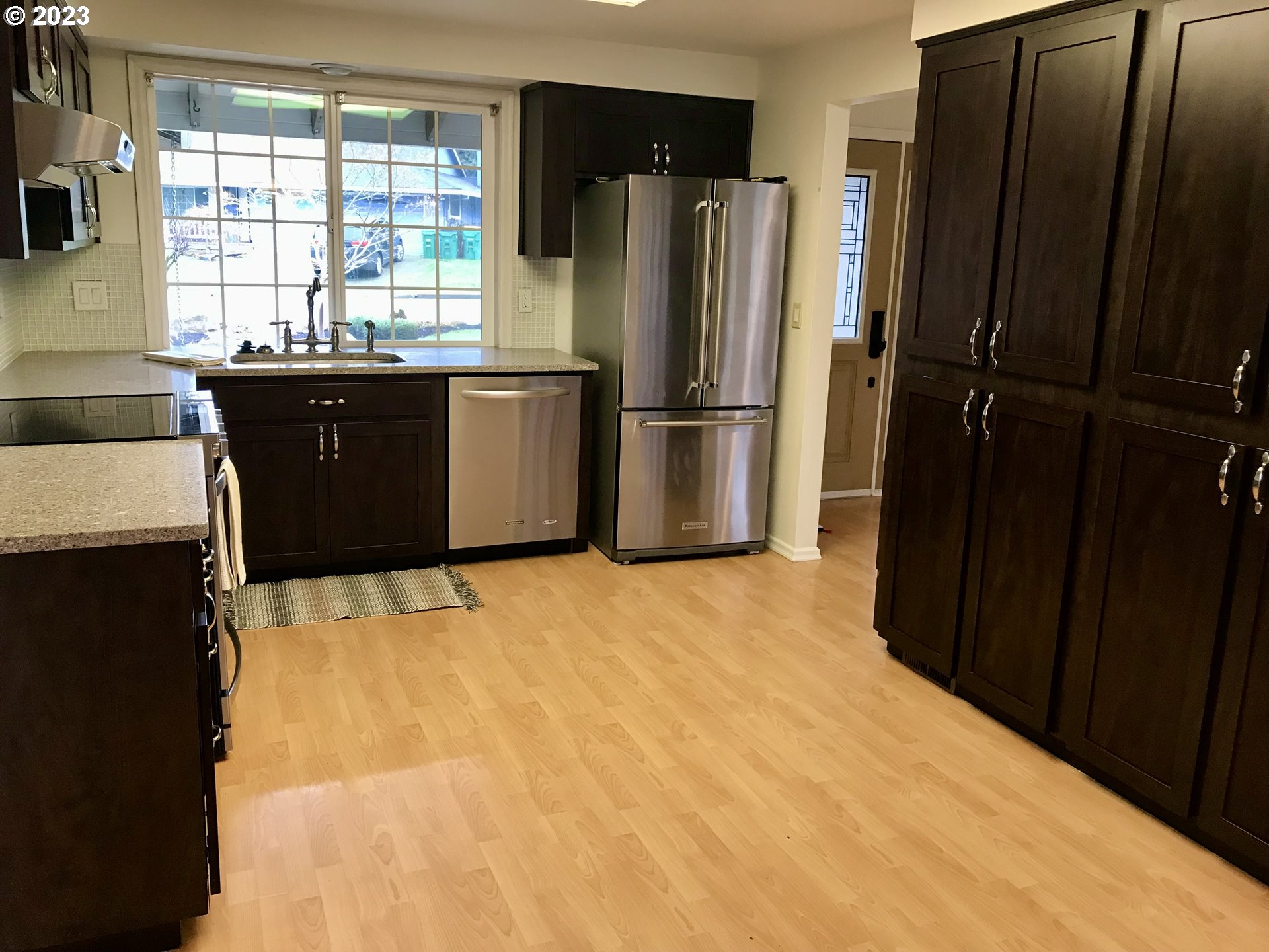7175 Southwest 173rd Avenue Beaverton, OR 97007 - Photo 8 of 20 a kitchen with a refrigerator and a sink
