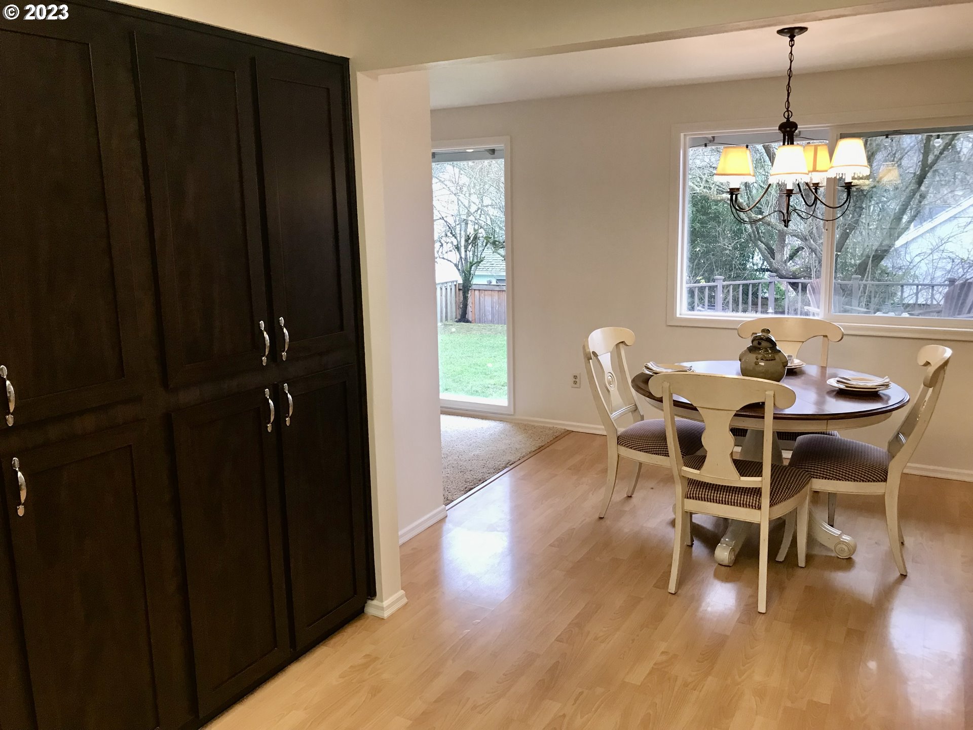 7175 Southwest 173rd Avenue Beaverton, OR 97007 - Photo 10 of 20 a dining room with furniture window and wooden floor