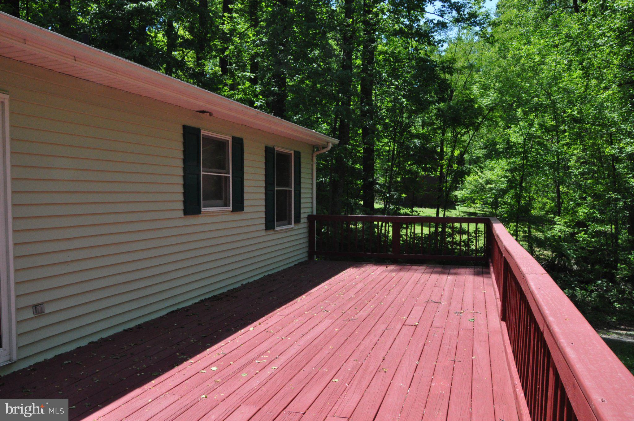 28 Henry Way Linden, VA 22642 - Photo 22 of 39 a view of deck with wooden floor and fence next to a yard