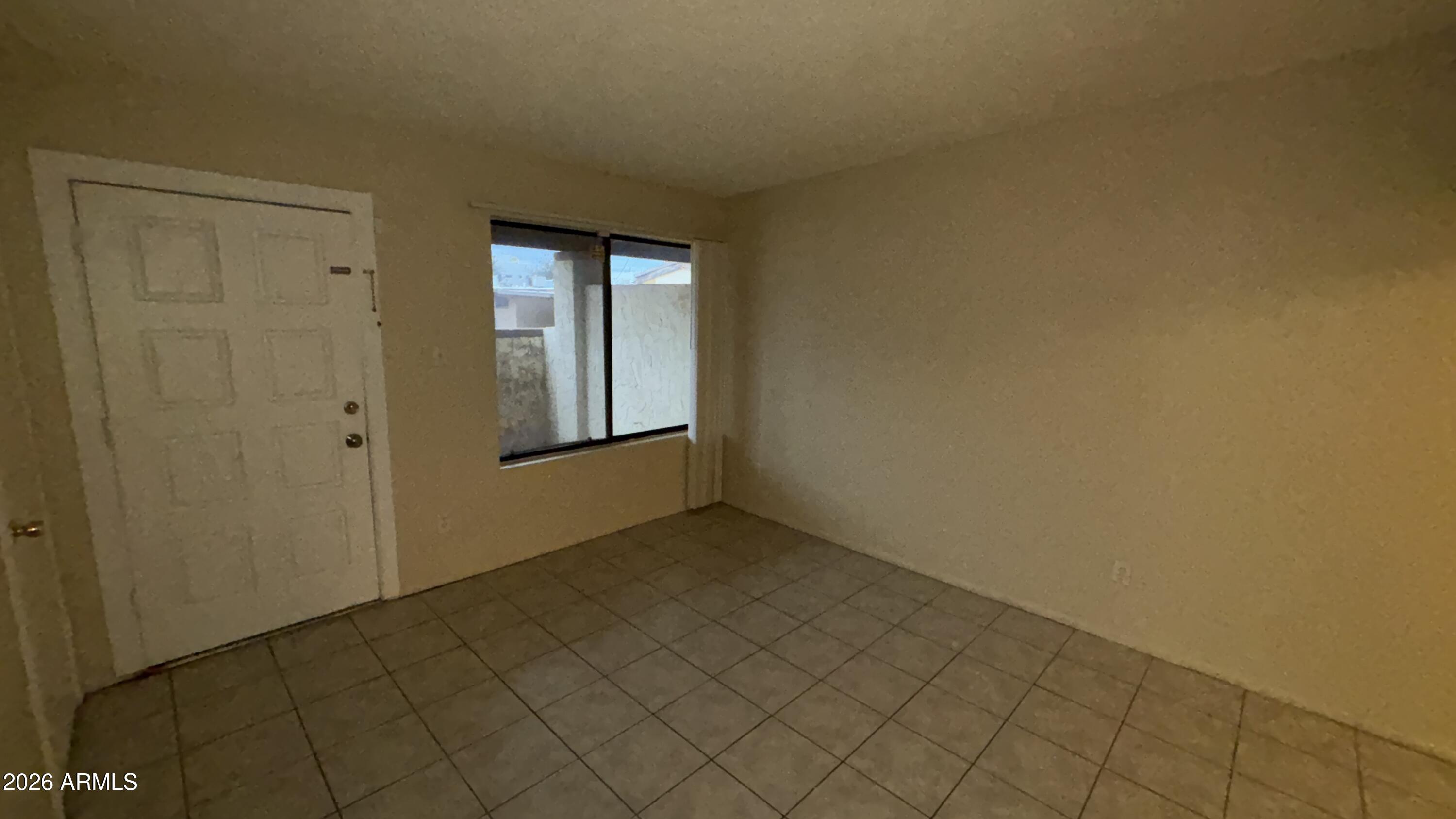 1301 West 3rd Street, Unit 3 Tempe, AZ 85281 - Photo 4 of 16 a view of an empty room and window