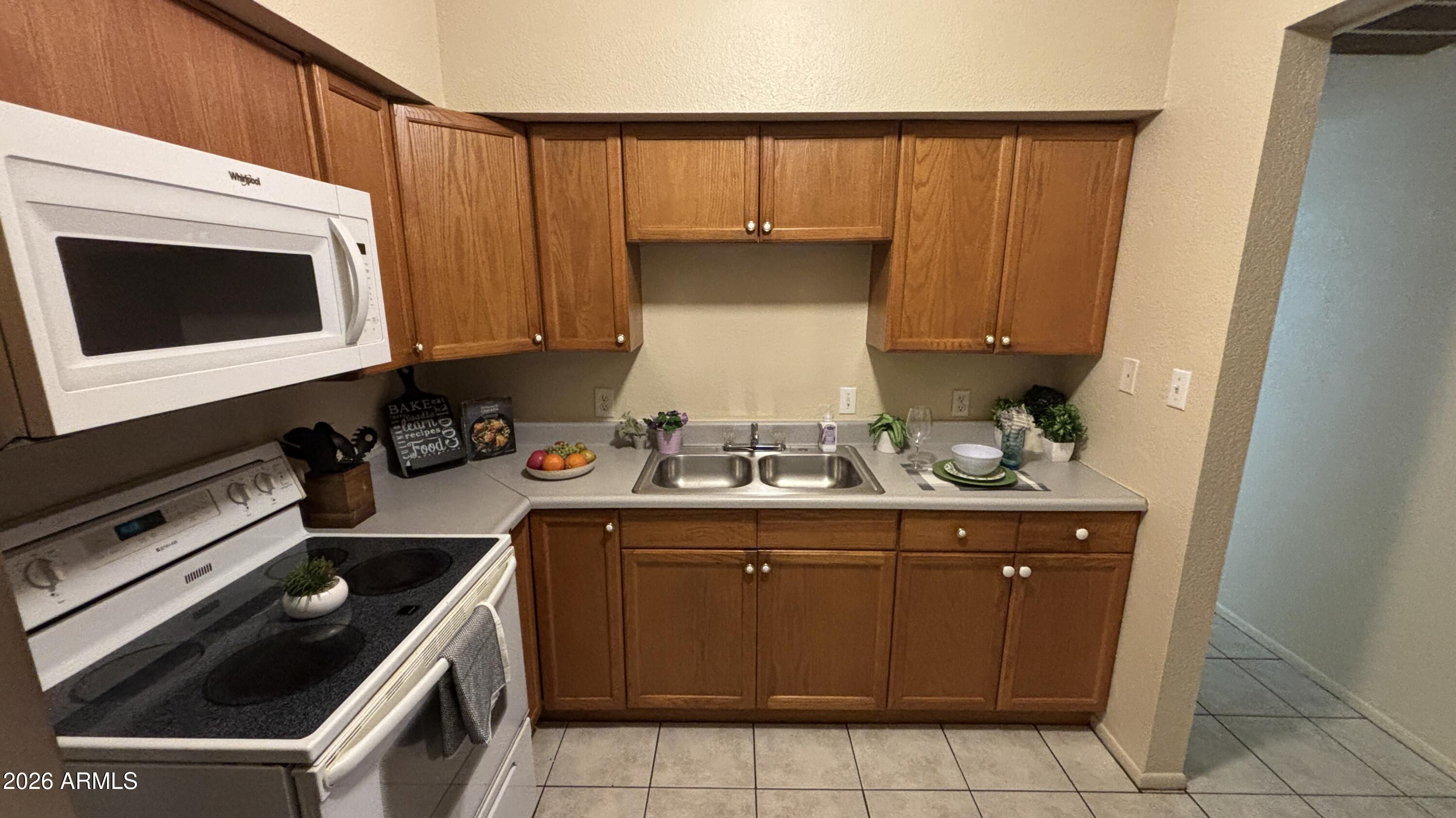 1301 West 3rd Street, Unit 3 Tempe, AZ 85281 - Photo 7 of 16 a kitchen with a cabinets and white stove