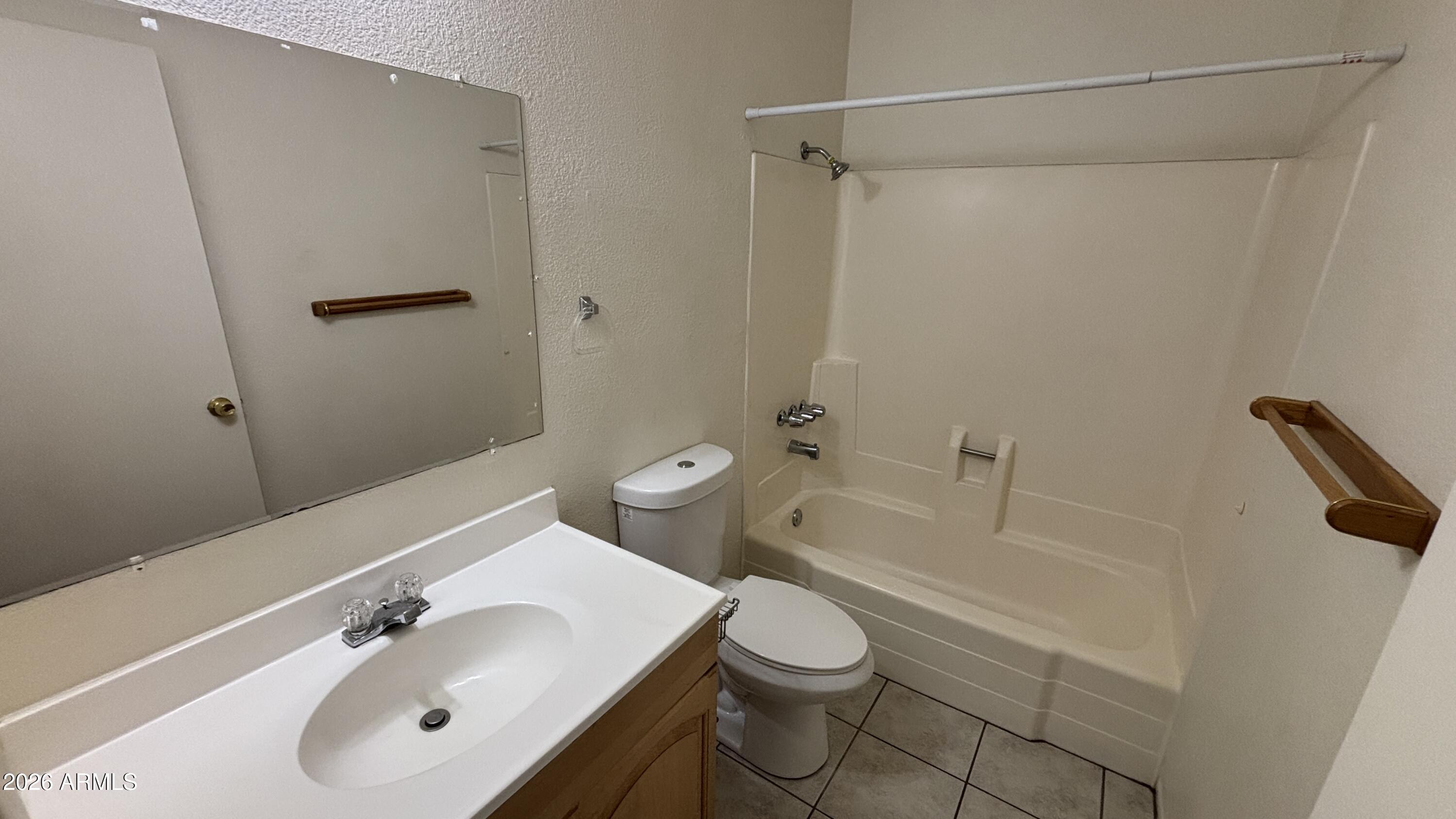1301 West 3rd Street, Unit 3 Tempe, AZ 85281 - Photo 8 of 16 a bathroom with a sink a toilet and shower