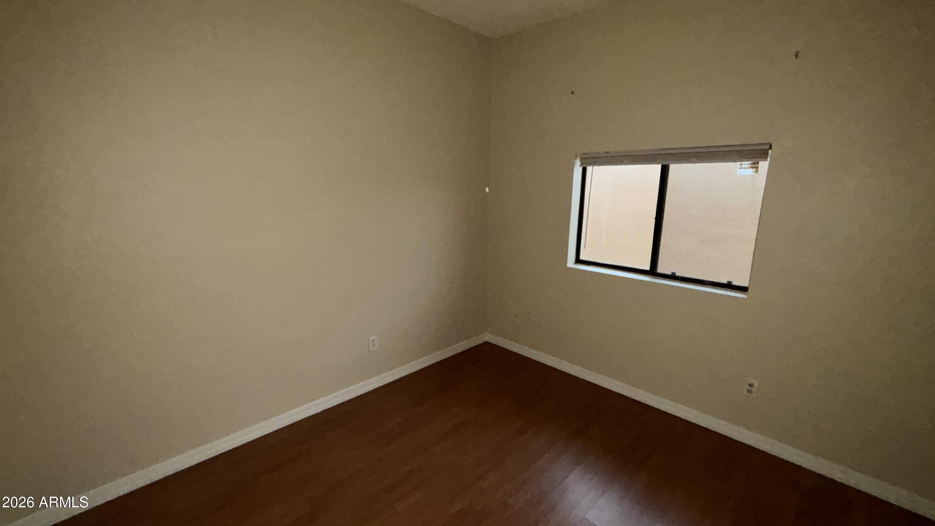 1301 West 3rd Street, Unit 3 Tempe, AZ 85281 - Photo 9 of 16 an empty room with a window