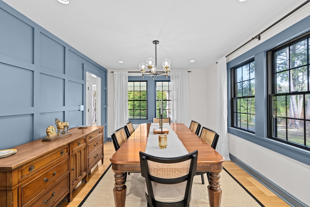 348 Main Street Norwell, MA 02061 - Photo 12 of 42 a dining room with furniture a chandelier and wooden floor