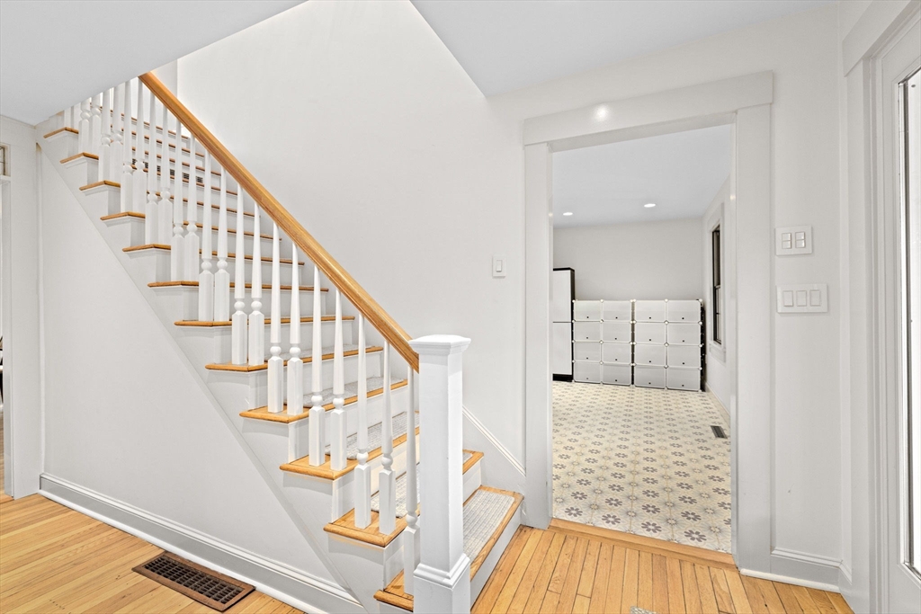 348 Main Street Norwell, MA 02061 - Photo 18 of 42 a view of staircase with wooden floor and white walls