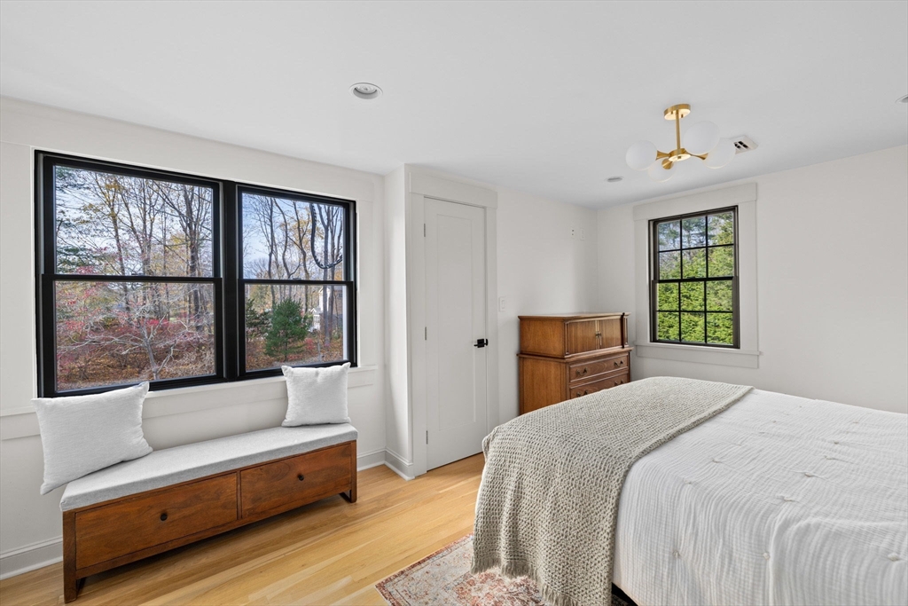 348 Main Street Norwell, MA 02061 - Photo 20 of 42 a bedroom with a bed couch and window