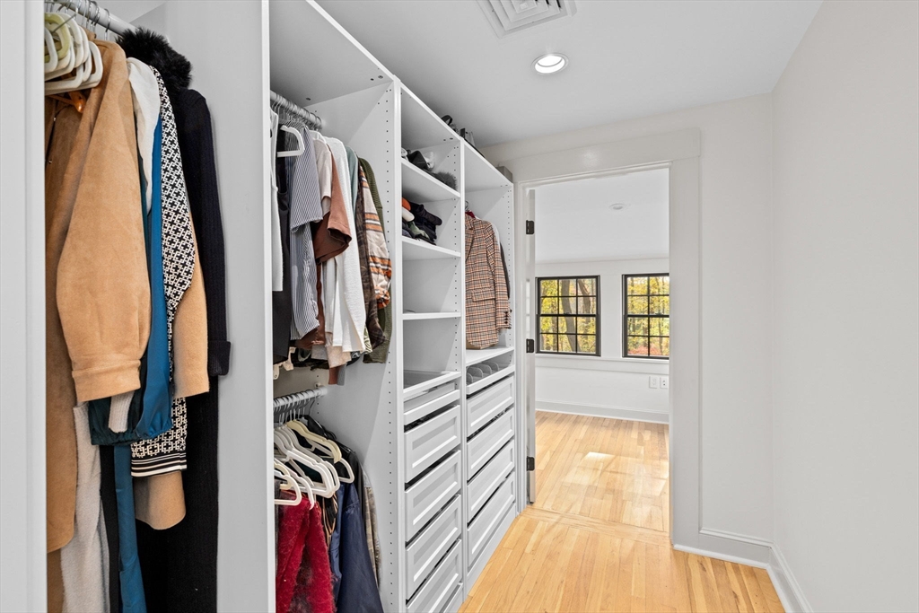 348 Main Street Norwell, MA 02061 - Photo 23 of 42 a view of walk in closet with clothes and shoes