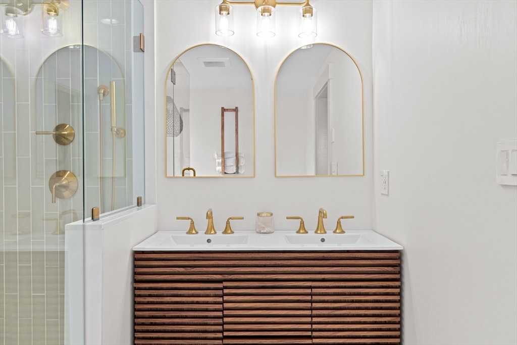 348 Main Street Norwell, MA 02061 - Photo 27 of 42 a bathroom with a sink and a mirror