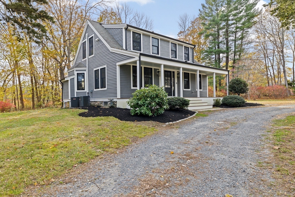 348 Main Street Norwell, MA 02061 - Photo 33 of 42 a front view of a house with a yard