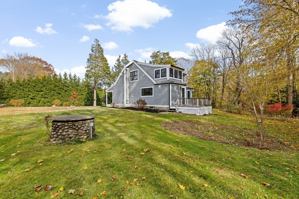 348 Main Street Norwell, MA 02061 - Photo 37 of 42 a front view of a house with a yard