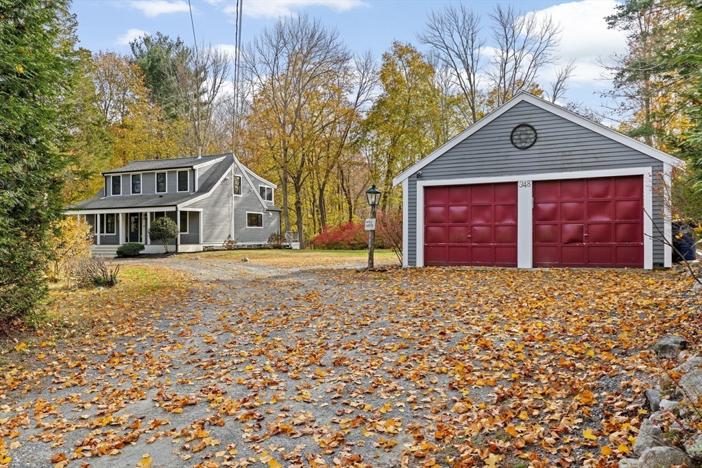 348 Main Street Norwell, MA 02061 - Photo 39 of 42 a front view of a house with a yard