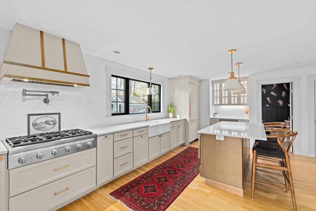 348 Main Street Norwell, MA 02061 - Photo 5 of 42 a kitchen with granite countertop a stove oven and white cabinets