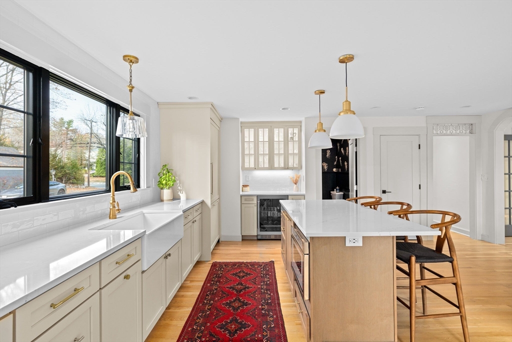 348 Main Street Norwell, MA 02061 - Photo 7 of 42 a large kitchen with kitchen island a large window in it
